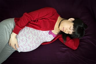 a person lying on a bed