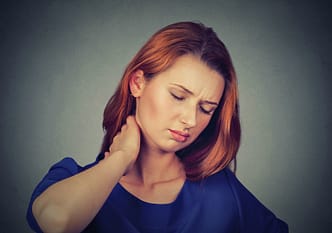 a woman with her hand on her face